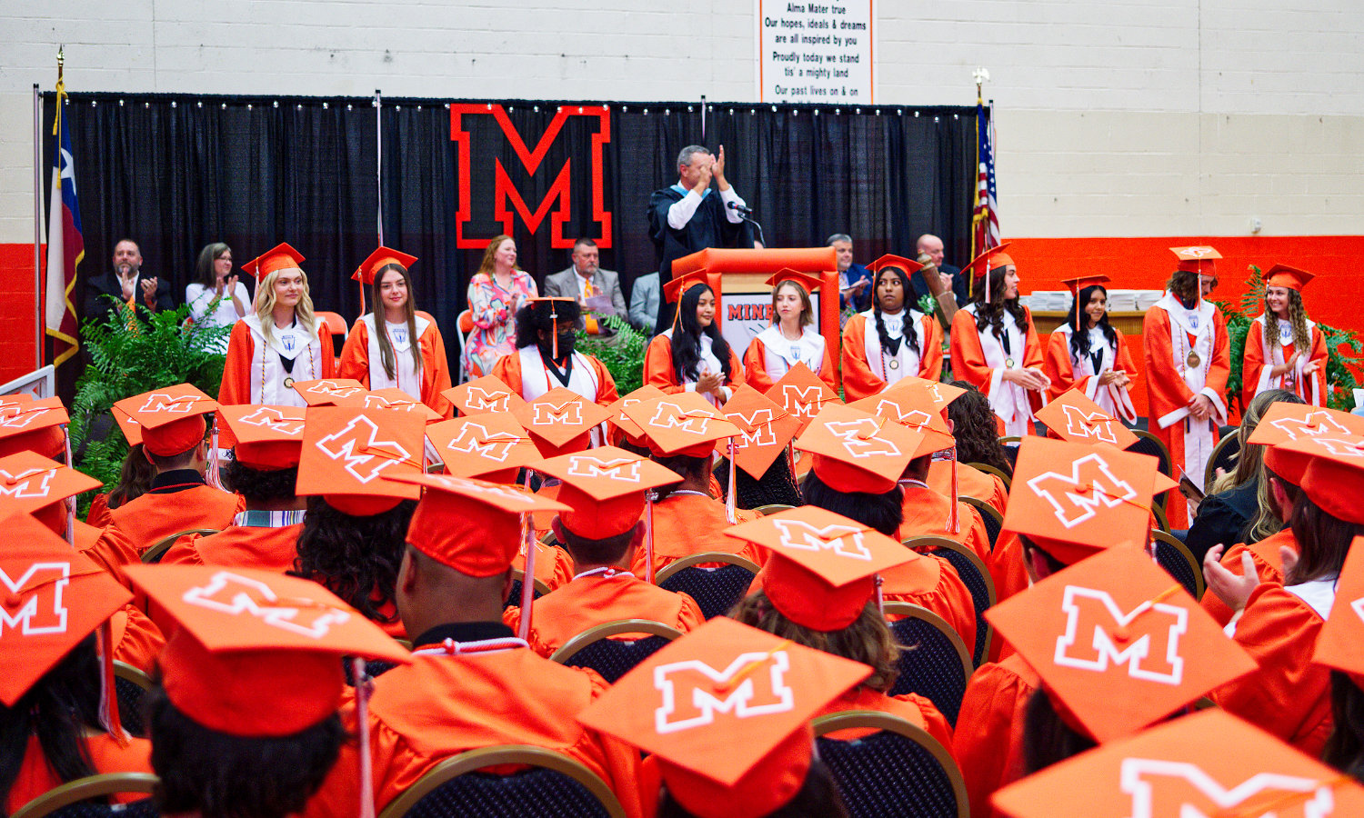 Mineola's top ten graduates are honored. [observe more orange, get grad gifts]